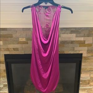 Silky feel razorback tank with a peekaboo back.